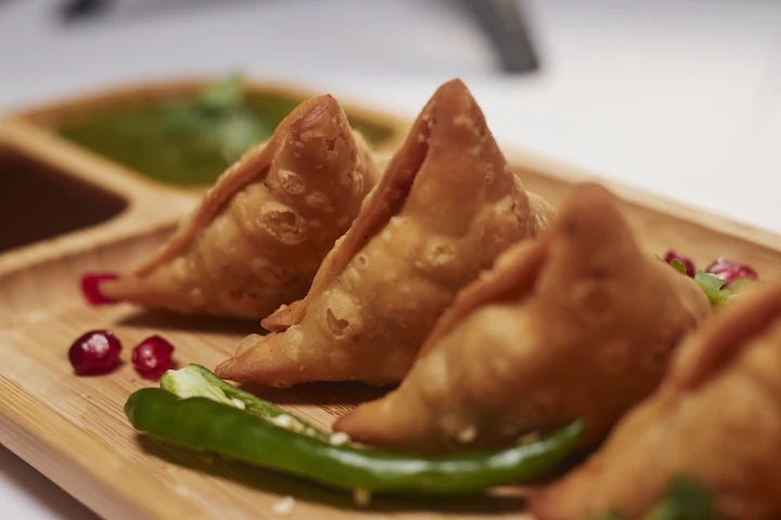 Crisp homemade farsan served with green chutney